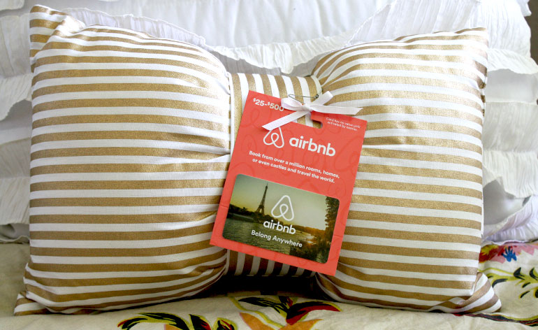 Airbnb gift card on a bed and breakfast pillow